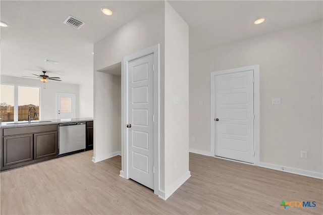 kitchen featuring dishwasher, sink, ceiling fan, and light hardwood / wood-style floors