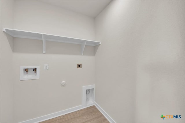 laundry area with hookup for a gas dryer, electric dryer hookup, hookup for a washing machine, and light hardwood / wood-style flooring