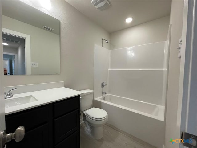 full bathroom with toilet, vanity, bathtub / shower combination, and wood-type flooring