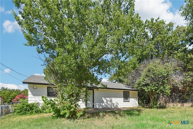 back of house with fence