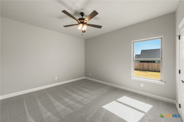 spare room with ceiling fan and carpet floors