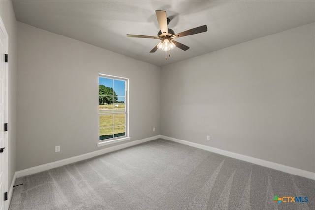 carpeted empty room with ceiling fan