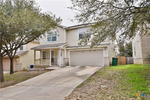 view of front of home featuring a garage and a porch