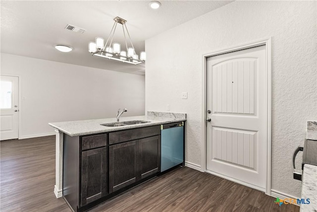 kitchen with dishwashing machine, dark wood-style floors, a peninsula, and a sink