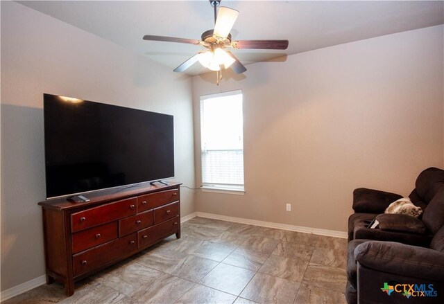 602 Park Place Ln, Temple, TX 76504 - living area featuring a ceiling fan and baseboards