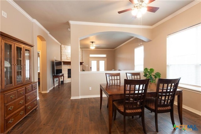 602 Park Place Ln, Temple, TX 76504 - dining space featuring a ceiling fan, arched walkways, healthy amount of natural light, dark wood finished floors, and crown molding