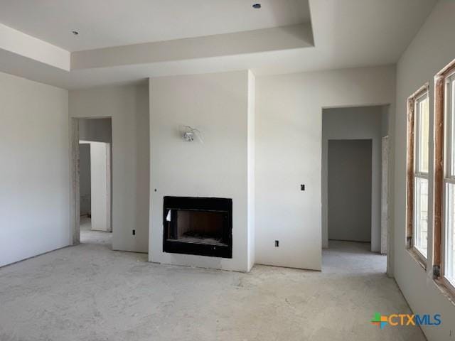 490 County Road 56, Copperas Cove, TX 76522 - unfurnished living room featuring a fireplace and a raised ceiling