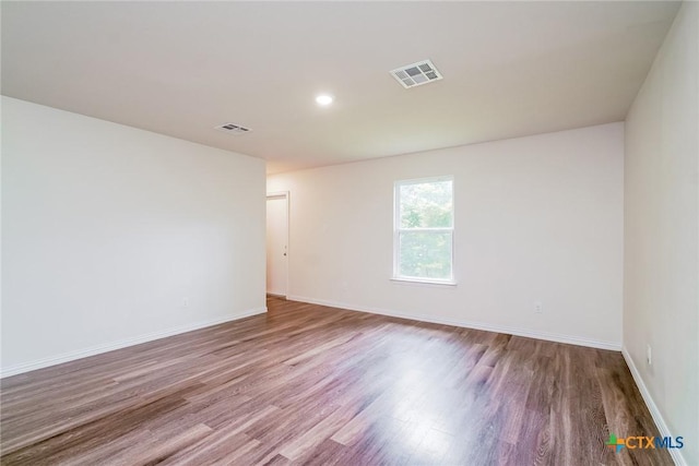 613 S 24th St, Temple, TX 76501 - unfurnished room with visible vents, wood finished floors, and baseboards