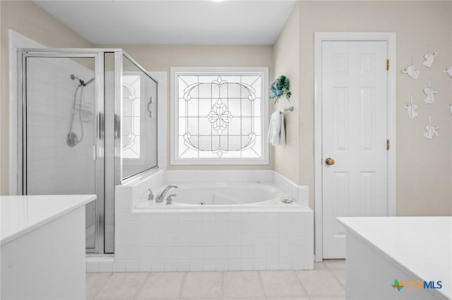 301 Deerchase, Victoria, TX 77901 - bathroom featuring a tub with jets, a shower stall, and tile patterned floors