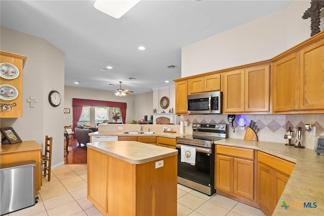 301 Deerchase, Victoria, TX 77901 - kitchen with stainless steel appliances, a sink, light tile patterned floors, light countertops, and recessed lighting