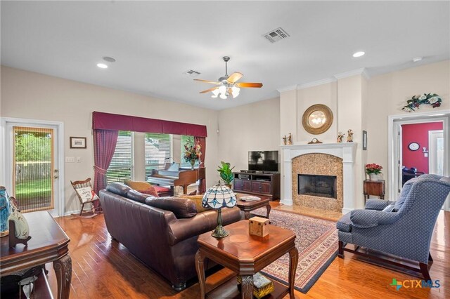 301 Deerchase, Victoria, TX 77901 - living room featuring ceiling fan, plenty of natural light, wood finished floors, a fireplace, and recessed lighting