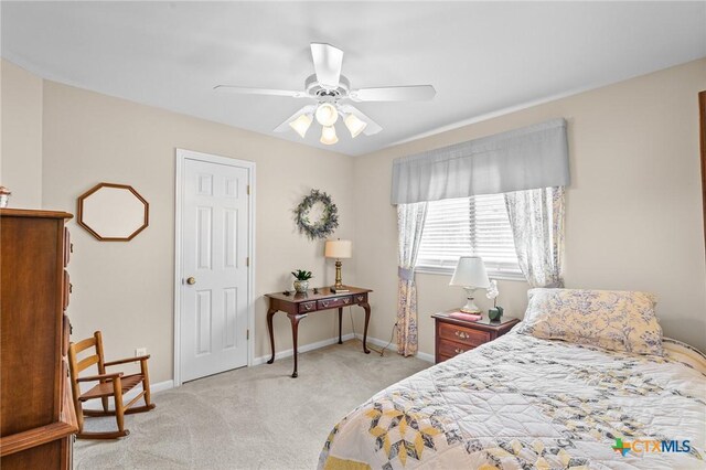 301 Deerchase, Victoria, TX 77901 - bedroom featuring light colored carpet, baseboards, and a ceiling fan