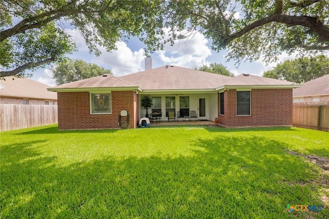 301 Deerchase, Victoria, TX 77901 - rear view of property featuring a chimney, brick siding, and a patio