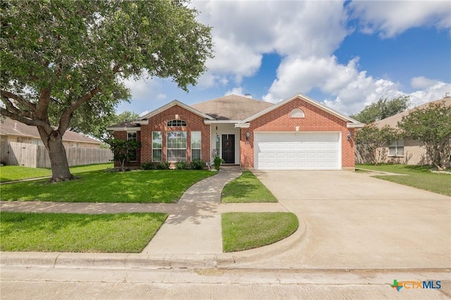 301 Deerchase, Victoria, TX 77901 - traditional-style house featuring an attached garage, brick siding, and concrete driveway