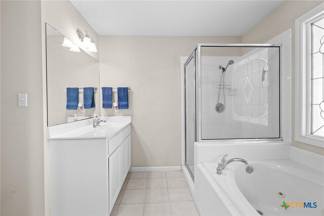 301 Deerchase, Victoria, TX 77901 - full bathroom featuring vanity, a stall shower, a whirlpool tub, tile patterned floors, and baseboards