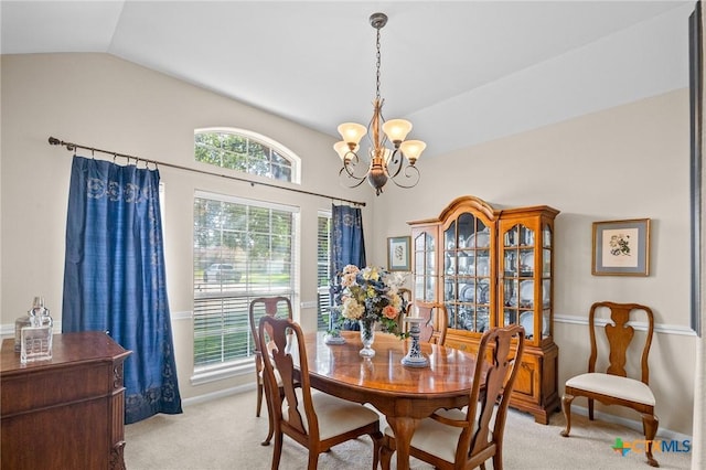 301 Deerchase, Victoria, TX 77901 - dining space with light colored carpet, vaulted ceiling, a chandelier, and baseboards