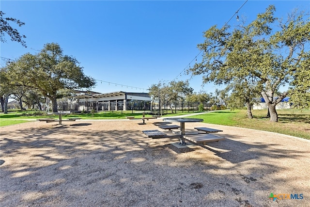 view of property's community with a lawn