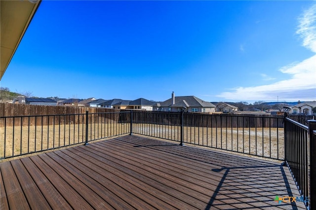 wooden terrace with a residential view