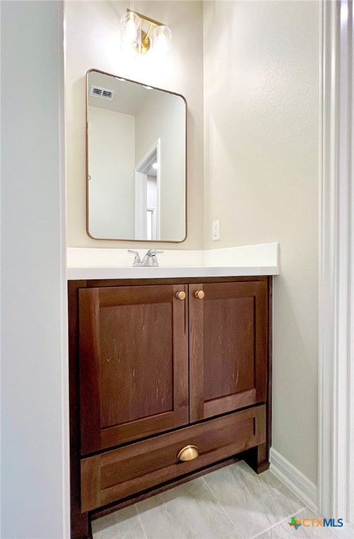 bathroom featuring vanity and tile patterned flooring