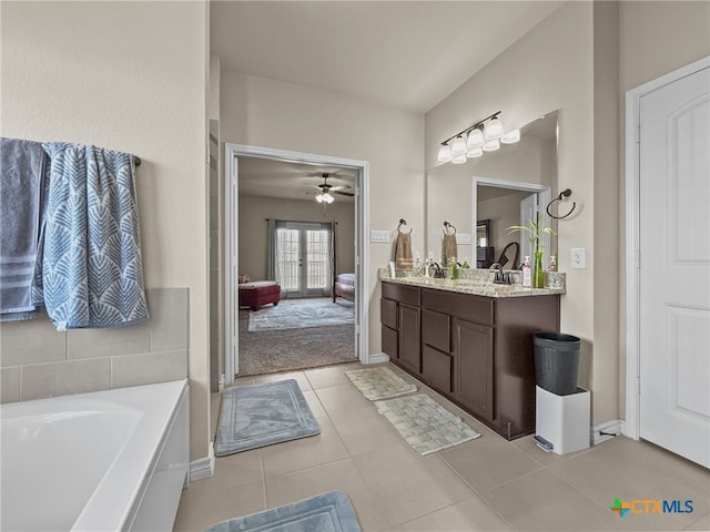 1306 Torino St, Harker Heights, TX 76548 - ensuite bathroom with vanity, a bath, a ceiling fan, tile patterned flooring, and french doors