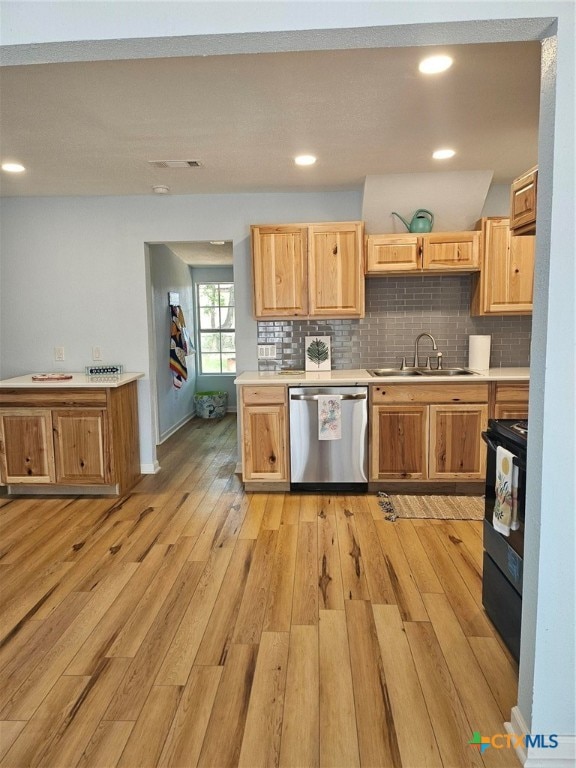 kitchen featuring dishwasher, light hardwood / wood-style flooring, sink, and electric range