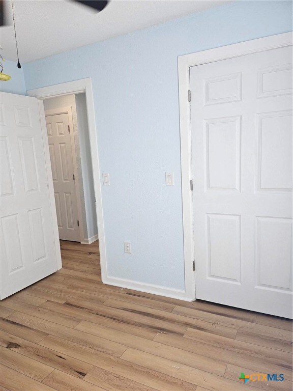 unfurnished bedroom featuring light hardwood / wood-style floors