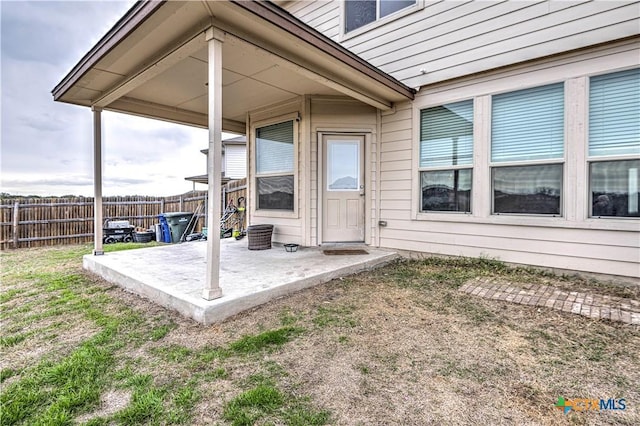 doorway to property with a patio