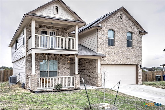 view of front of home featuring a front lawn, central AC unit, a garage, covered porch, and a balcony