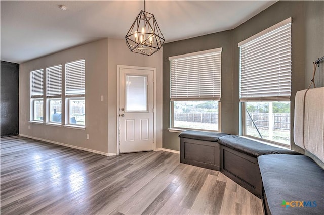 entrance foyer featuring an inviting chandelier and light wood-type flooring