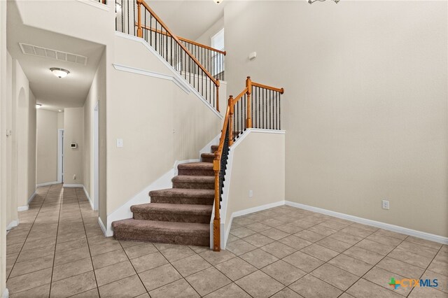 3411 Aubree Katherine Dr, Killeen, TX 76542 - staircase with tile patterned flooring and a towering ceiling
