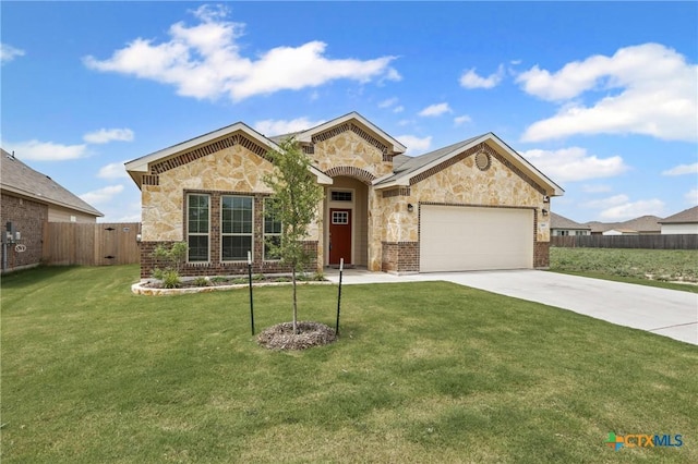 7109 Hammermill Ln, Temple, TX 76502 - view of front of property featuring a garage, stone siding, driveway, and brick siding