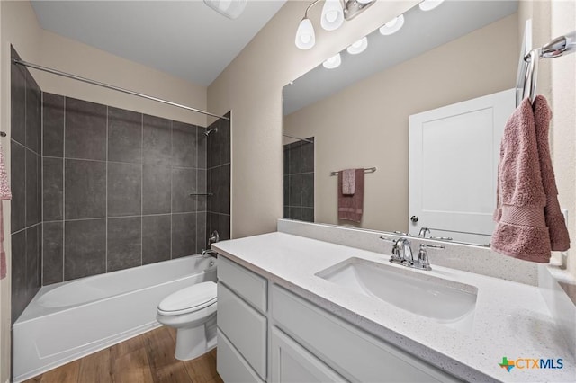 7109 Hammermill Ln, Temple, TX 76502 - bathroom featuring vanity, wood finished floors, and tub / shower combination