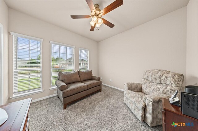 7109 Hammermill Ln, Temple, TX 76502 - carpeted living area with a ceiling fan and vaulted ceiling