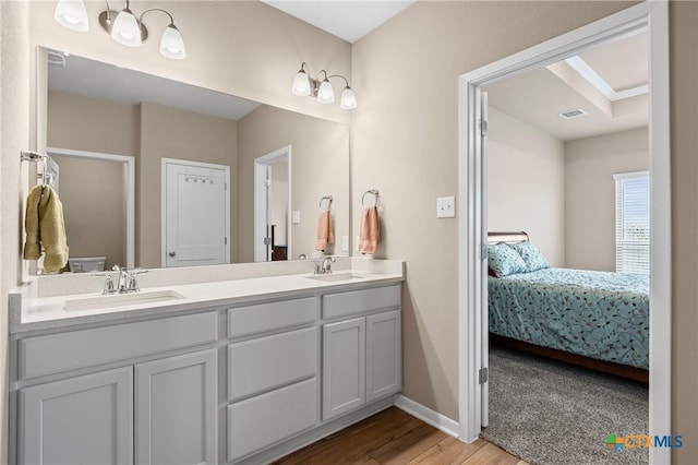 7109 Hammermill Ln, Temple, TX 76502 - ensuite bathroom featuring wood finished floors and double vanity