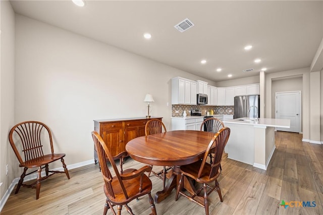 7109 Hammermill Ln, Temple, TX 76502 - dining area with light wood-type flooring and recessed lighting