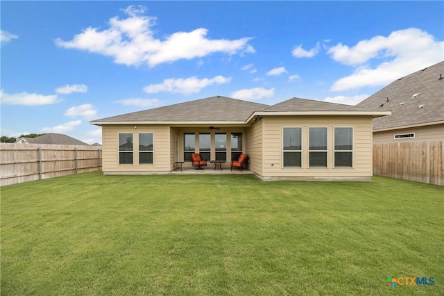 7109 Hammermill Ln, Temple, TX 76502 - back of property featuring a ceiling fan, a fenced backyard, and a patio area