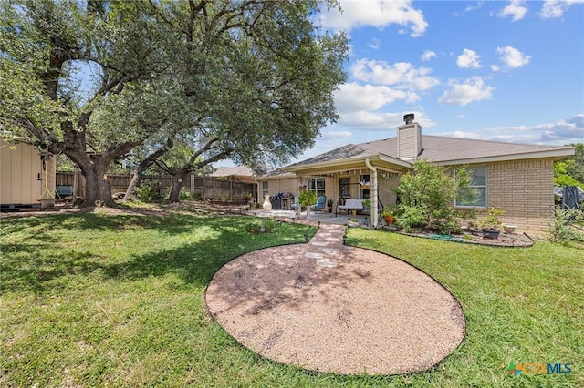 2903 Curtis Dr, Copperas Cove, TX 76522 - back of house featuring brick siding, a patio, and a chimney