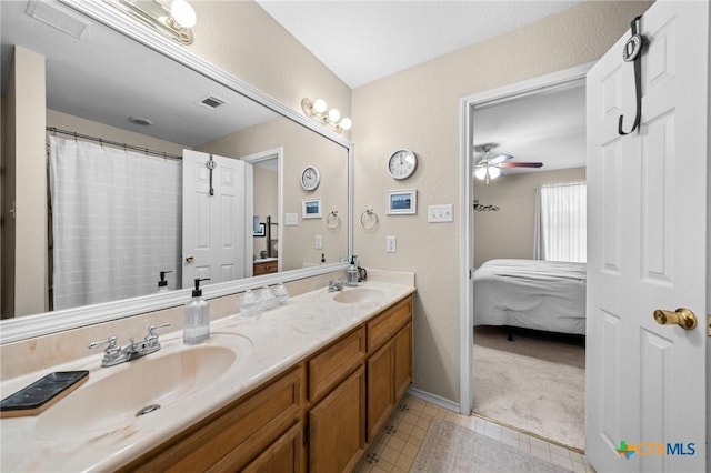 2903 Curtis Dr, Copperas Cove, TX 76522 - bathroom with double vanity, connected bathroom, and ceiling fan