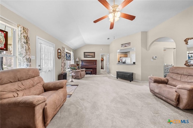 2903 Curtis Dr, Copperas Cove, TX 76522 - living room featuring a ceiling fan, arched walkways, carpet flooring, and vaulted ceiling