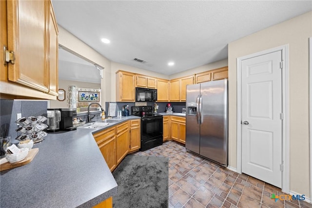 2903 Curtis Dr, Copperas Cove, TX 76522 - kitchen featuring black appliances, recessed lighting, and light countertops