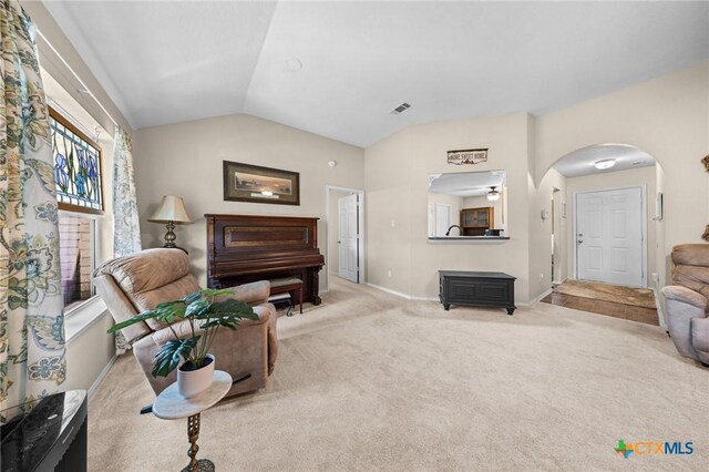 2903 Curtis Dr, Copperas Cove, TX 76522 - carpeted living area featuring lofted ceiling and arched walkways