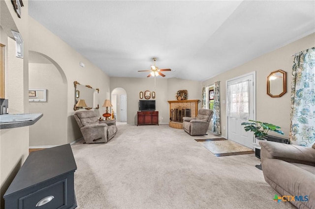 2903 Curtis Dr, Copperas Cove, TX 76522 - living area with arched walkways, a fireplace, a ceiling fan, and carpet floors