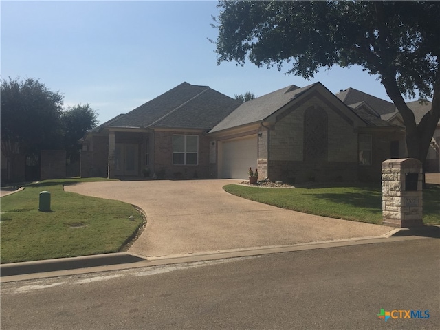 view of front facade with a front lawn and a garage