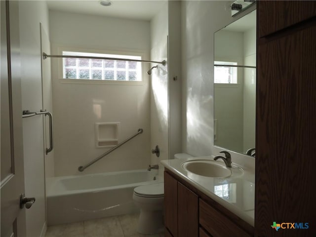 full bathroom featuring toilet, tile patterned flooring, bathing tub / shower combination, and vanity