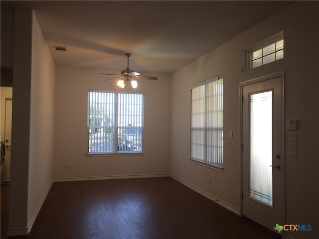 interior space featuring ceiling fan and dark hardwood / wood-style floors