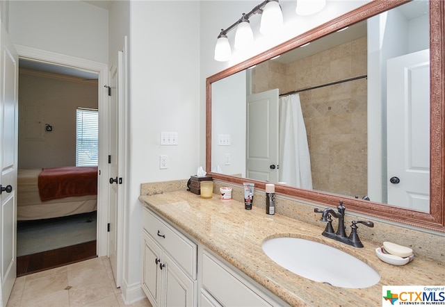 bathroom featuring walk in shower, tile patterned flooring, and vanity