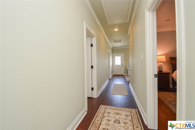 hall featuring dark hardwood / wood-style floors and crown molding