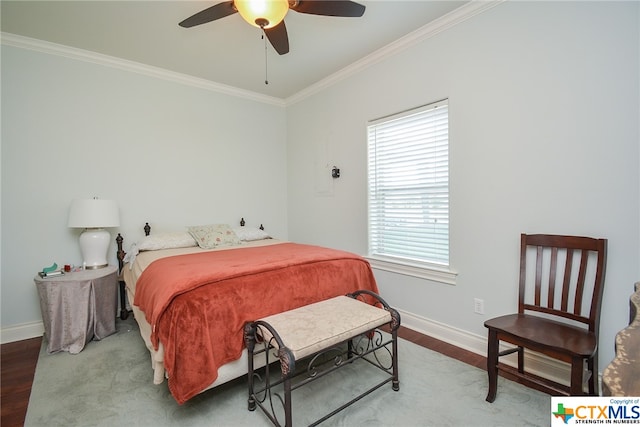 bedroom with hardwood / wood-style flooring, ceiling fan, and crown molding