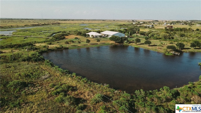 drone / aerial view featuring a rural view and a water view