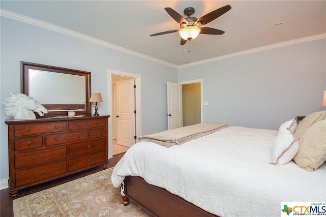 bedroom with ornamental molding, wood-type flooring, and ceiling fan